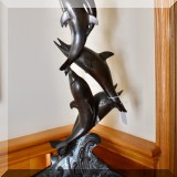 A45. Bronze leaping dolphins sculpture. 23”h